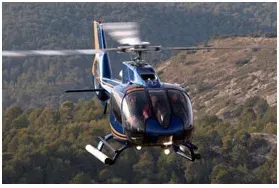 Helicopter parked outside a hangar for aircraft management services