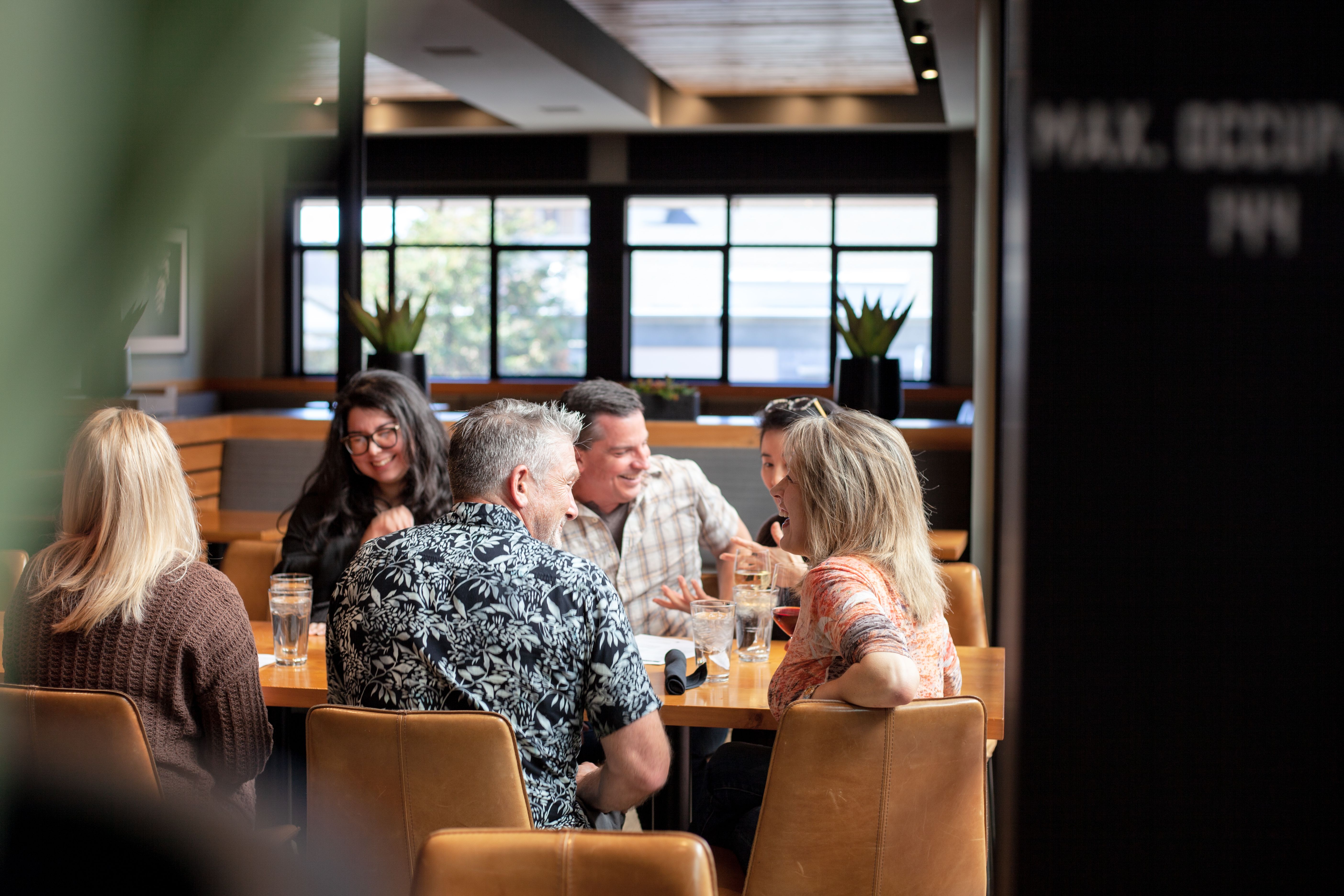 Six people at a Carmel by the Sea restaurant enjoying themselves