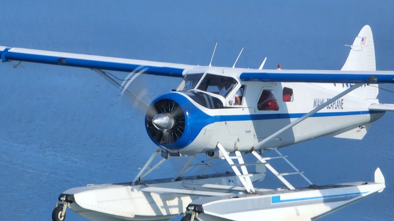 Miami Seaplane flying to Bimini over turquoise waters.&nbsp;