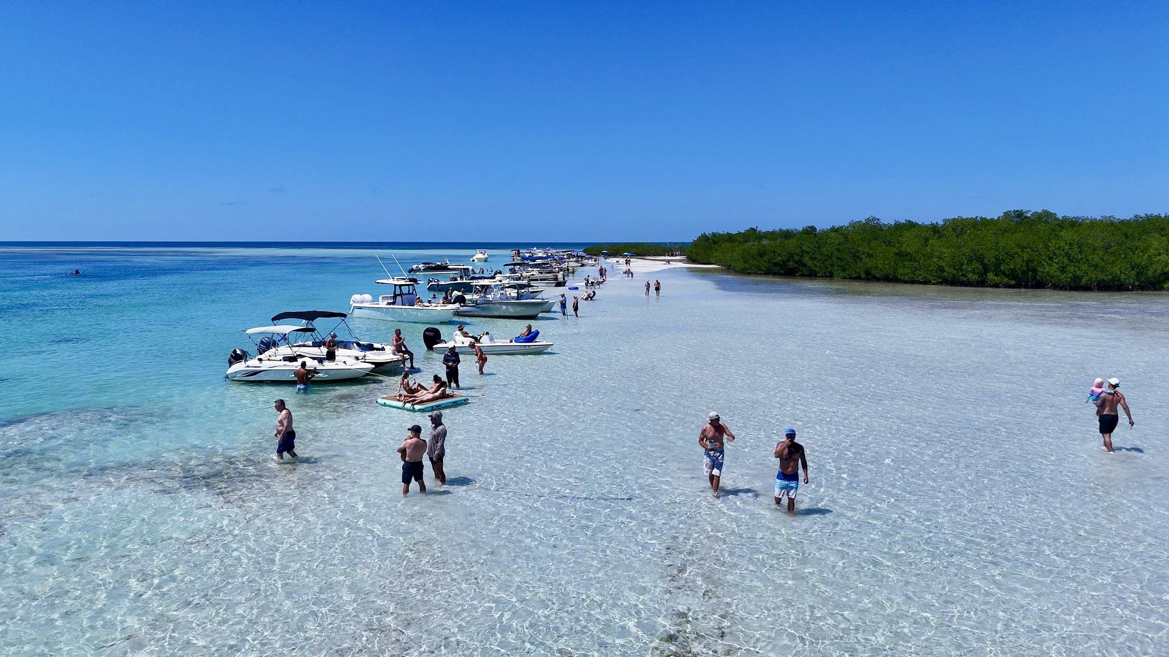 Aerial view of boats and swimmers at a Key West sandbar