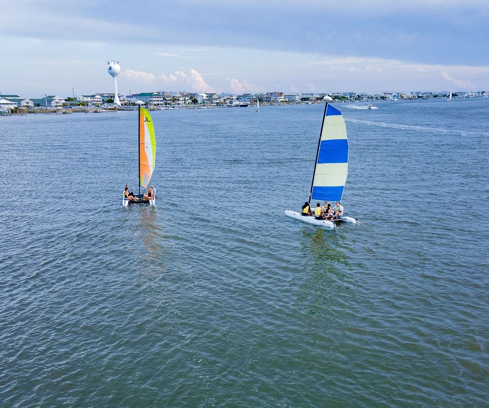 Two Hobie catamarans sailing on the sound in Wrightsville Beach
