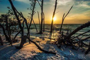 a sunset over a body of water